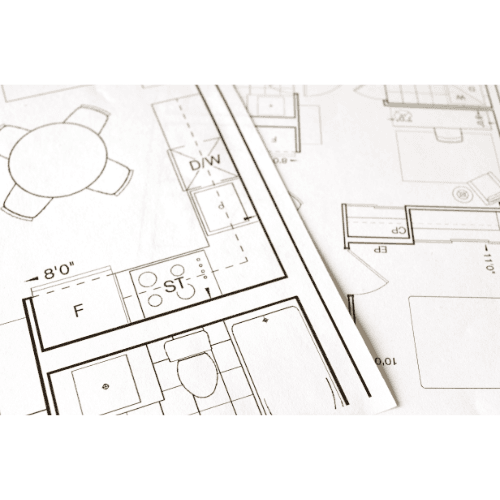 Close-up of architectural blueprints showing multiple room layouts.